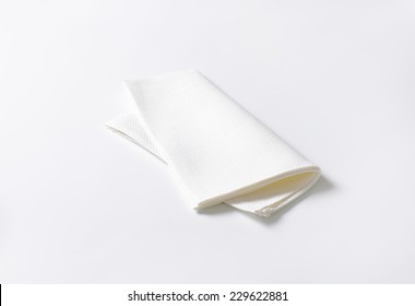 Folded White Napkin On White Background