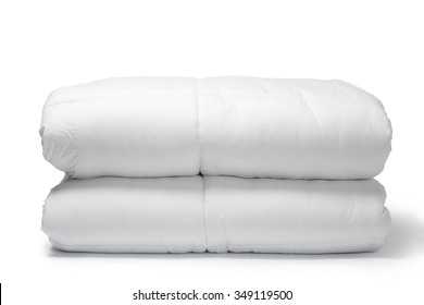 Folded White Quilt On White Background