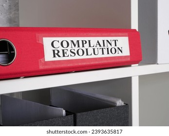 Folder with complaint resolution papers.