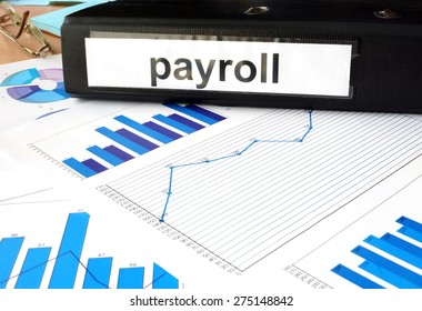 Folder With The Label Payroll And Charts