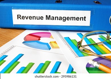 Folder With Label Revenue Management  And Charts.