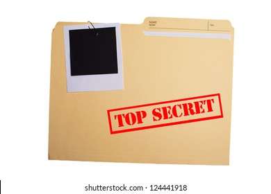 A folder with TOP SECRET stamped across the front and a blank photograph clipped to it