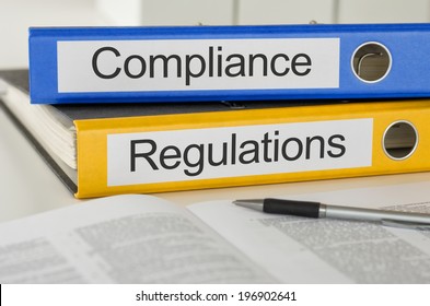 Folders With The Label Compliance And Regulations