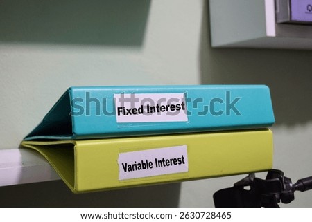 folders labeled fixed and variable interest, loan management concept
