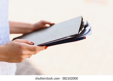 folders in woman hands  - Shutterstock ID 382102000