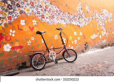 Folding Bike With Old Wall, Vintage Color.