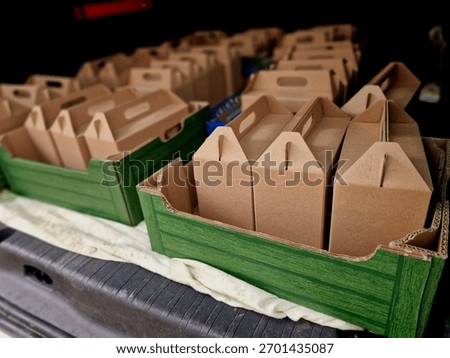folding boxes for transporting gift packages such as alcohol, food or local products. products from our paper mill for your business talent. car trunk full of bribes