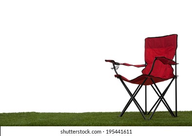 Folding Camp Chair Angled On Grass With White Background