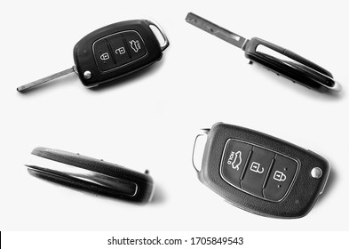 Folding car key close-up top view isolated on a white background. Auto keys set different sides. Black, chrome and grey colors. 3D.