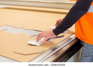 Folding Cardboard At The Printing Plant