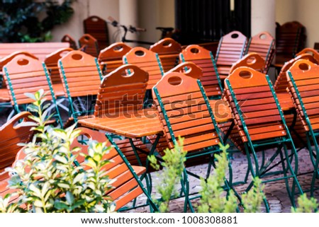 folding chairs and tables at a beergarden.