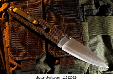 Folding Knife With Orange Gel From Above On Ballistic Nylon