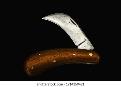 Folding Pruning Knife With Curved Long Blade On Black Background