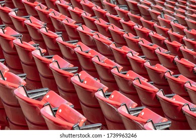 Folding Red Plastic Stadium Seats.  No People.