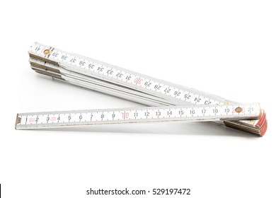 Folding rule with centimeter scale on white background