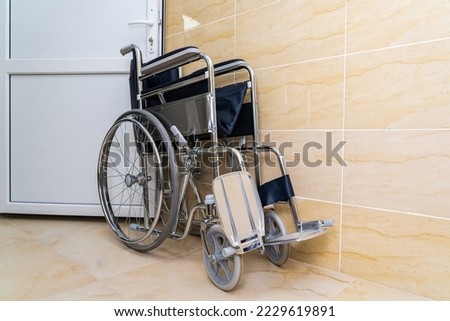 Similar – Senior woman in a wheelchair alone