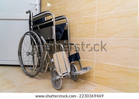 Similar – Senior woman in a wheelchair alone