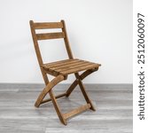 Folding wooden chair for a veranda or outdoor cafe