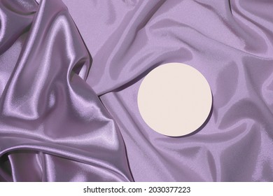 Folds Of Lilac Satin Fabric And Podium Pedestal For Cosmetics Or Perfume Top View