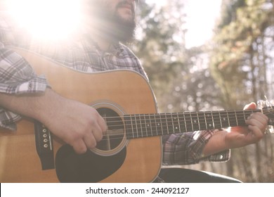 A Folk Country Musician Playing His Guitar. 