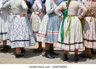 Folk dancers in traditional clothing - Shutterstock ID 2168766001