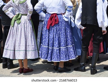 Folk dancers in traditional clothing - Shutterstock ID 2168766013