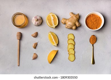 Folk remedies ginger, garlic, turmeric, honey, lemon. Ingridients for making drinks to prevent and treat colds and support the immune system. Herbal medicine an anti-inflammatory. Flat lay, knolling