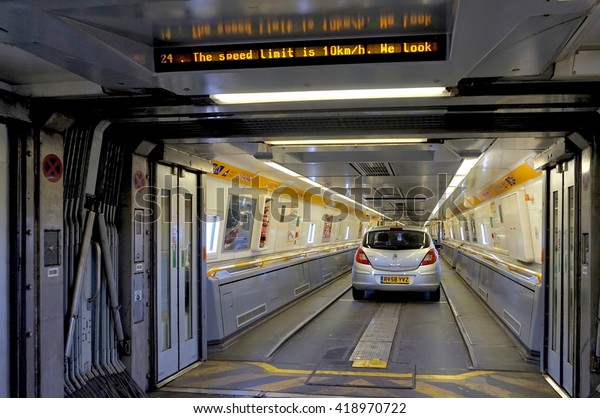 FOLKESTONE, ENGLAND, MAY 07\
2016: Doors between carriages on the Euro Tunnel train from France\
to Folkestone in the United Kingdom are open as the cars start to\
drive off