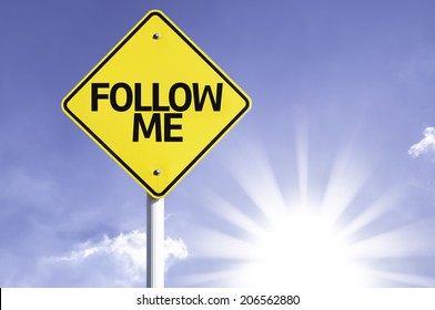 Follow Me Road Sign With Sun Background 