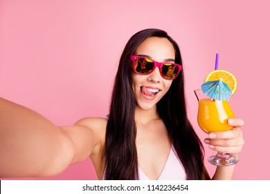Follow me subscribers! Social influencer concept. Close up studio photo portrait of cool hipster nice carefree lady holding juice in hand taking selfie isolated bright pastel background - Powered by Shutterstock