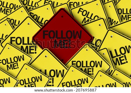 Follow Me! written on multiple road sign