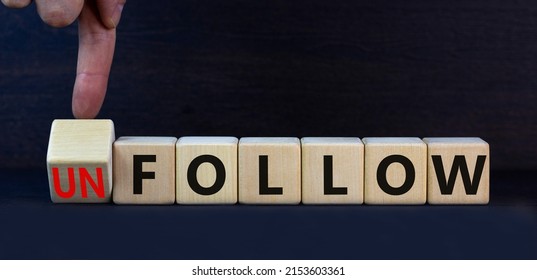 Follow or unfollow symbol. Turned wooden cubes and changed concept words Follow to Unfollow. Beautiful grey table grey background. Business and follow or unfollow concept. Copy space.
