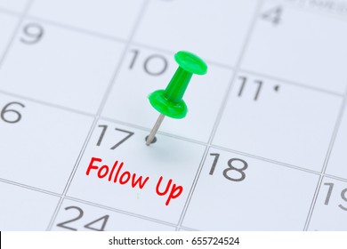 Follow Up written on  a calendar with a green push pin to remind you and important appointment.  - Shutterstock ID 655724524