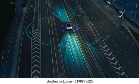 Following Aerial Drone View: Autonomous Self Driving Car Moving Through City Highway. Visualization Concept: Sensor Scanning Road Ahead for Vehicles, Danger, Speed Limits. Evening Urban Driveway