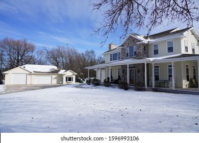 Fond Du Lac, Wisconsin / USA - January 21st, 2019: Front View Of A Large Beautiful Yellow Luxury Home Sits On A Hill Outside Of Fond Du Lac During The Cold Winter. 