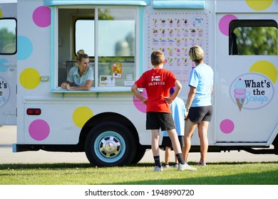 Fond Du Lac, Wisconsin USA - August 20th, 2019: Family And Kids Buying Ice Cream And Treats From A Ice Cream Truck. 