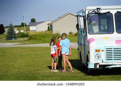 Fond Du Lac, Wisconsin USA - August 20th, 2019: Family And Kids Buying Ice Cream And Treats From A Ice Cream Truck. 