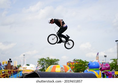 Fond Du Lac, Wisconsin USA - July 14th, 2019: Bicycle Stuntmen On BMX Doing Stunts On Half-pipe Ramps For A Crowd Of People At Fond Du Lac County Fair.