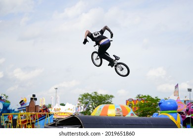 Fond Du Lac, Wisconsin USA - July 14th, 2019: Bicycle Stuntmen On BMX Doing Stunts On Half-pipe Ramps For A Crowd Of People At Fond Du Lac County Fair.