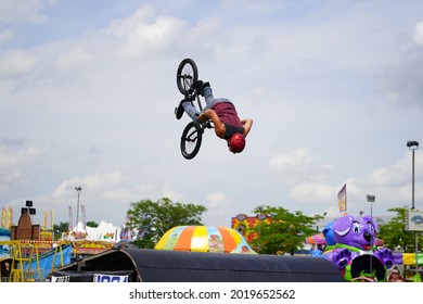 Fond Du Lac, Wisconsin USA - July 14th, 2019: Bicycle Stuntmen On BMX Doing Stunts On Half-pipe Ramps For A Crowd Of People At Fond Du Lac County Fair.