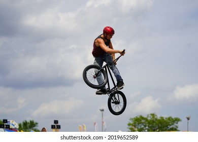 Fond Du Lac, Wisconsin USA - July 14th, 2019: Bicycle Stuntmen On BMX Doing Stunts On Half-pipe Ramps For A Crowd Of People At Fond Du Lac County Fair.