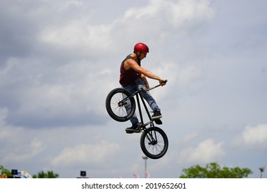 Fond Du Lac, Wisconsin USA - July 14th, 2019: Bicycle Stuntmen On BMX Doing Stunts On Half-pipe Ramps For A Crowd Of People At Fond Du Lac County Fair.