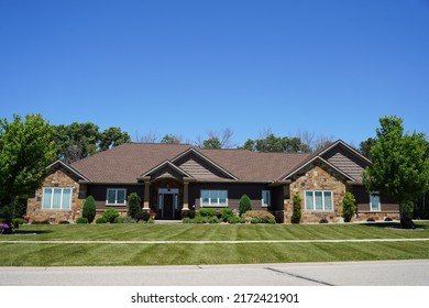 Fond Du Lac, Wisconsin USA - June 23rd, 2022: Brown Stone Ranch House Sits In The Community 