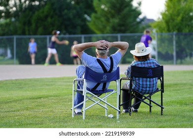 Fond Du Lac, Wisconsin USA - August 15th, 2019: Elderly Couple Sit And Spectate The Family Baseball Game At A Community Park. 