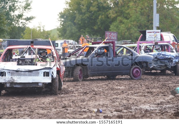 Fond\
du Lac, Wisconsin / USA - July 21st, 2019: Many Wreck broken down\
vehicles smash and run into each other in a\
derby.