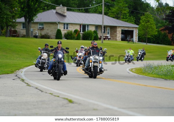 Fond du Lac, Wisconsin / USA - August 1st,
2020: Harley Davidson motorcyclists and bikers groups came out to
Fond du Lac to show support in a memorial benefit ride towards
Marine Phillip A.
Thiessen.
