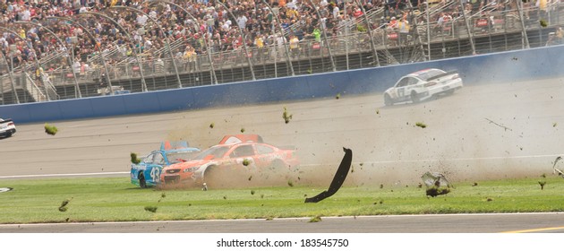 FONTANA, CA - MAR 23: Aric Almirola (43) And Brian Scott (33) Crash At The Nascar Sprint Cup Auto Club 400 Race At Auto Club Speedway In Fontana, CA On March 23, 2014