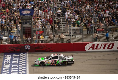 FONTANA, CA - MAR 23: Kyle Busch Takes The Checkered Flag To With The Nascar Sprint Cup Auto Club 400 Race At Auto Club Speedway In Fontana, CA On March 23, 2014