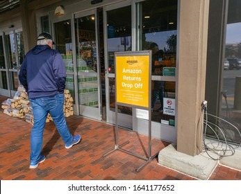 Fontana, California, United States - 01-26-2020: A Man Enters A Whole Foods Market Grocery Store And Passes A Sign That Says Amazon Returns Drop Off.