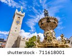 Fontana del Nettuno ( Neptune fountain statue ) in Trento - Trentino - Italy - Torre Civica or Torre di Piazza on the background